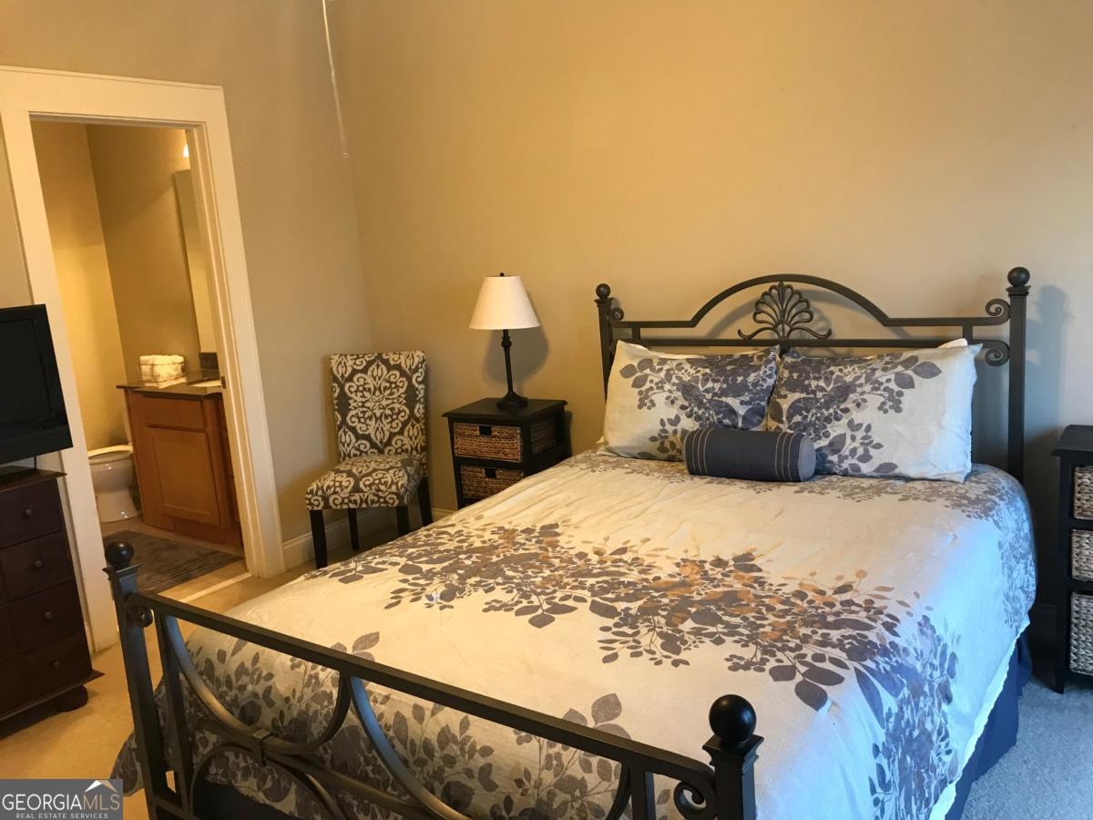 1500 Timothy Road, Unit D31 Athens, GA 30606 - Photo 19 of 19 a bed sitting in a bedroom next to a window