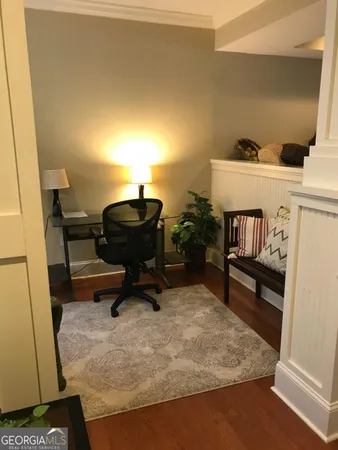 a living room with furniture and a rug