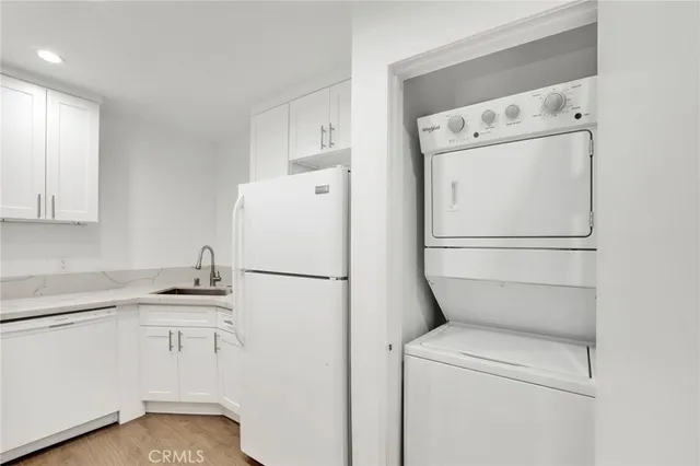a white refrigerator freezer sitting in a kitchen