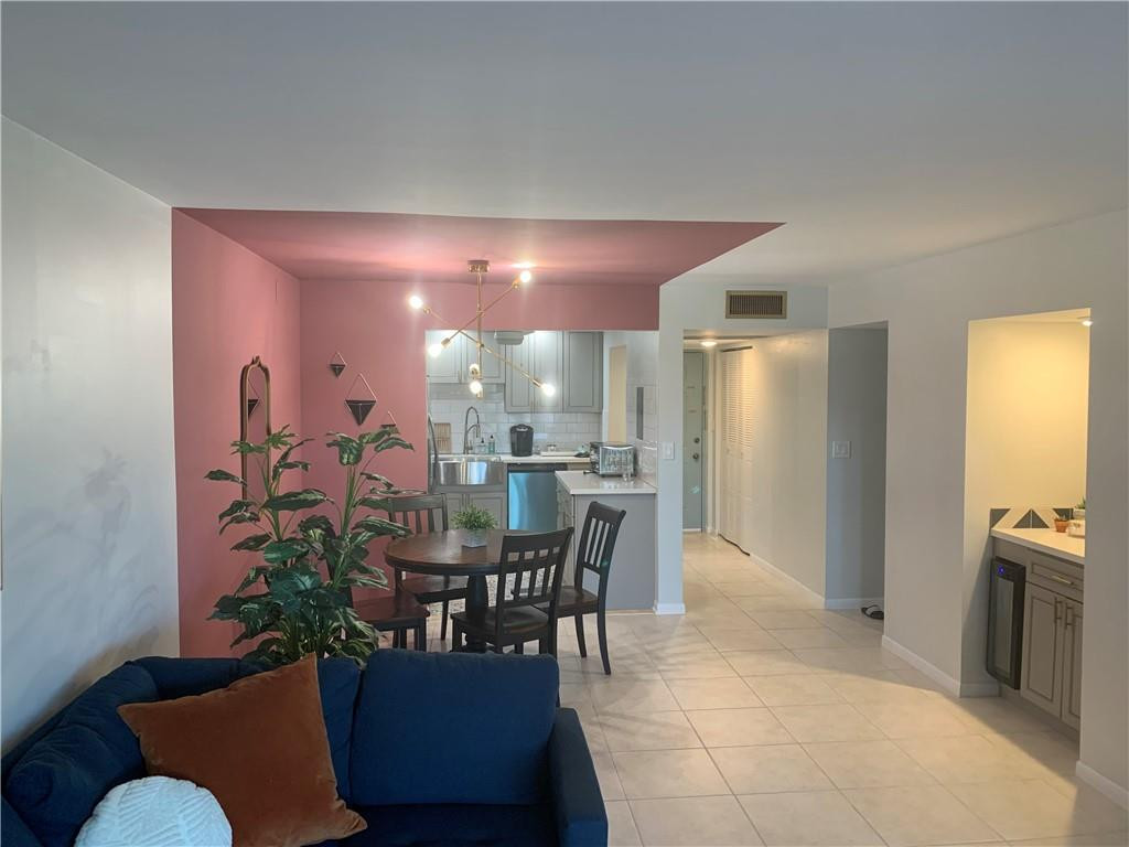 9370 Southwest 8th Street, Unit 323 Boca Raton, FL 33428 - Photo 12 of 17 a view of a dining room with furniture