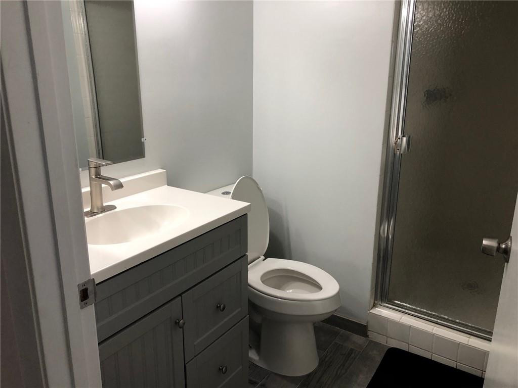 9370 Southwest 8th Street, Unit 323 Boca Raton, FL 33428 - Photo 6 of 17 a bathroom with a sink and a toilet