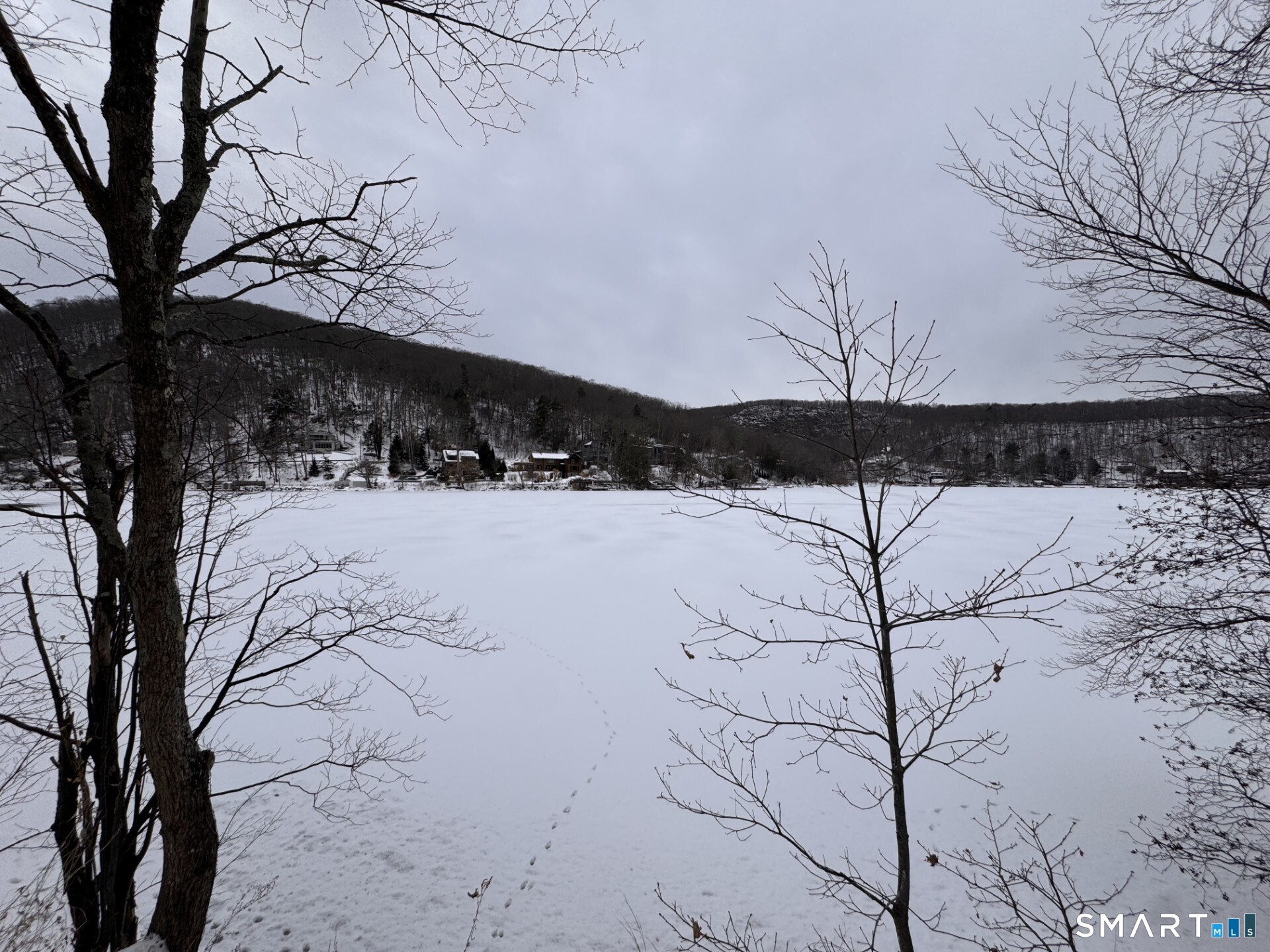 92 East Shore Road Washington, CT 06777 - Photo 3 of 4 a view of a snow covered with snow in the yard