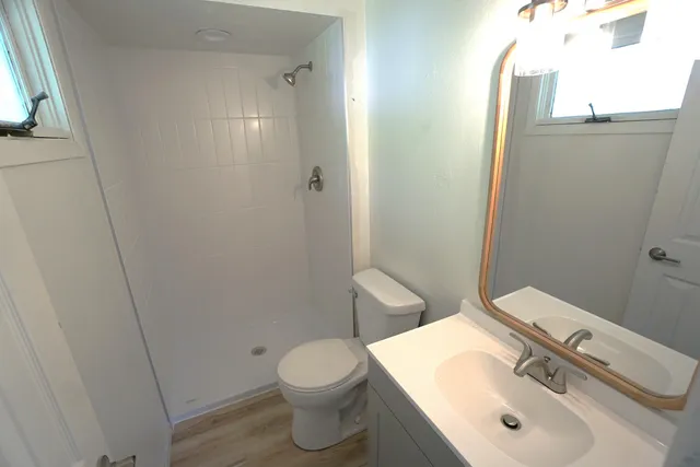 a view of balcony with wooden floor