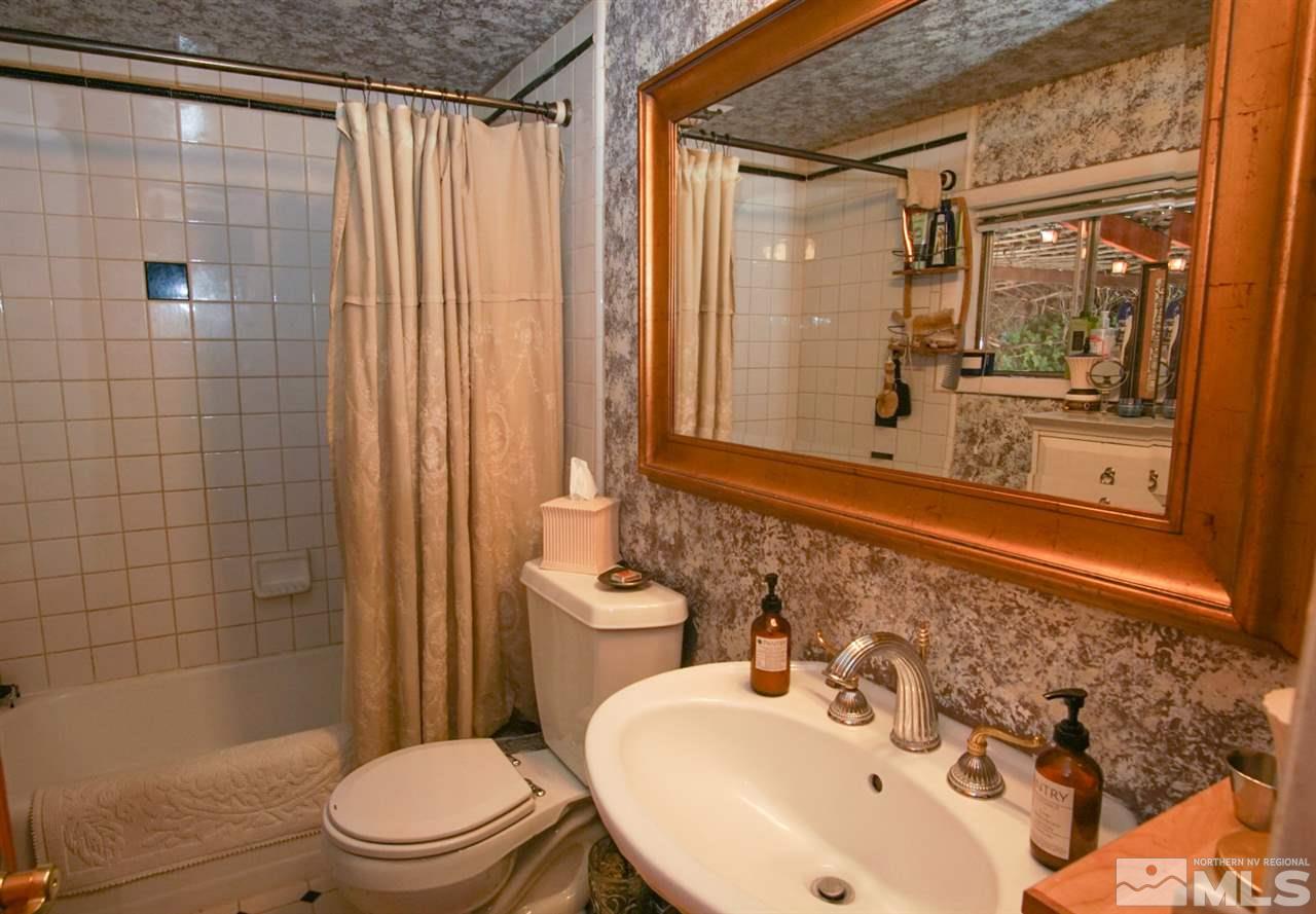 921 Washington Street Reno, NV 89503 - Photo 14 of 25 a bathroom with a sink toilet and shower