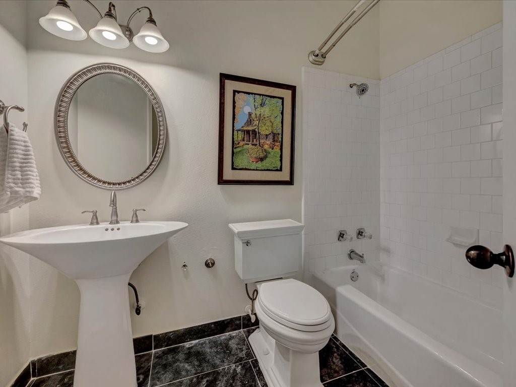 206 Cascade Court Lufkin, TX 75901 - Photo 21 of 27 a bathroom with a toilet a sink and a mirror