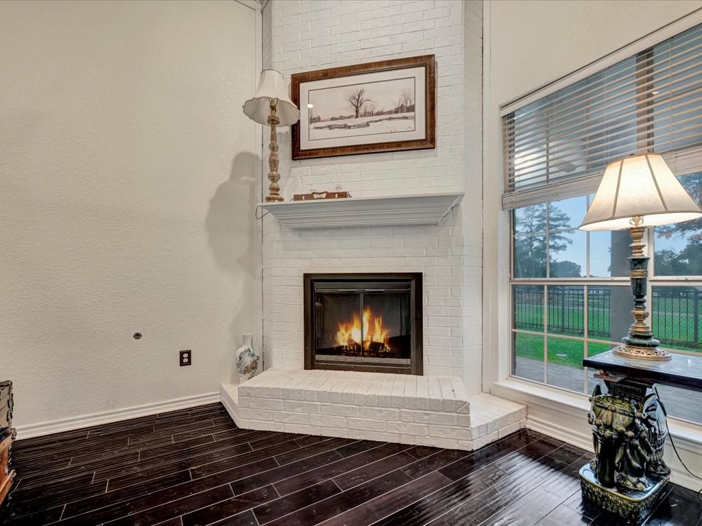 206 Cascade Court Lufkin, TX 75901 - Photo 7 of 27 a living room with furniture and a fireplace