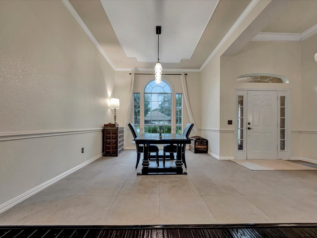 206 Cascade Court Lufkin, TX 75901 - Photo 8 of 27 a living room with furniture a table and a chandelier