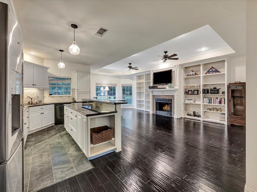 206 Cascade Court Lufkin, TX 75901 - Photo 9 of 27 a kitchen with stainless steel appliances a stove top oven and a refrigerator