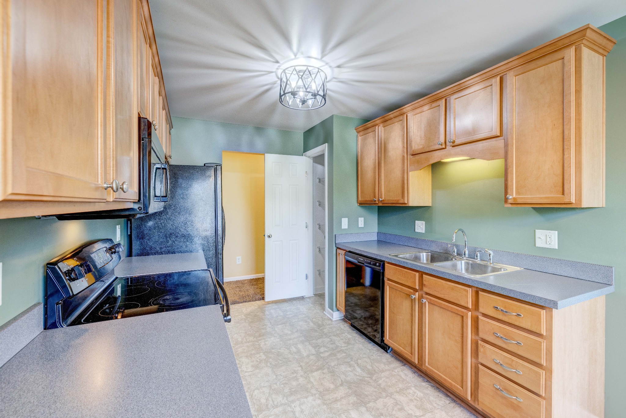 582 Cedar Grove Road Lebanon, TN 37087 - Photo 13 of 47 a kitchen with stainless steel appliances granite countertop a sink dishwasher stove and refrigerator with wooden floor