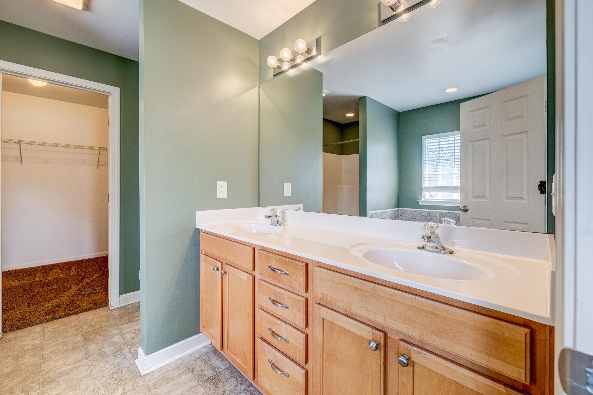 582 Cedar Grove Road Lebanon, TN 37087 - Photo 20 of 47 a bathroom with a double vanity sink and a mirror