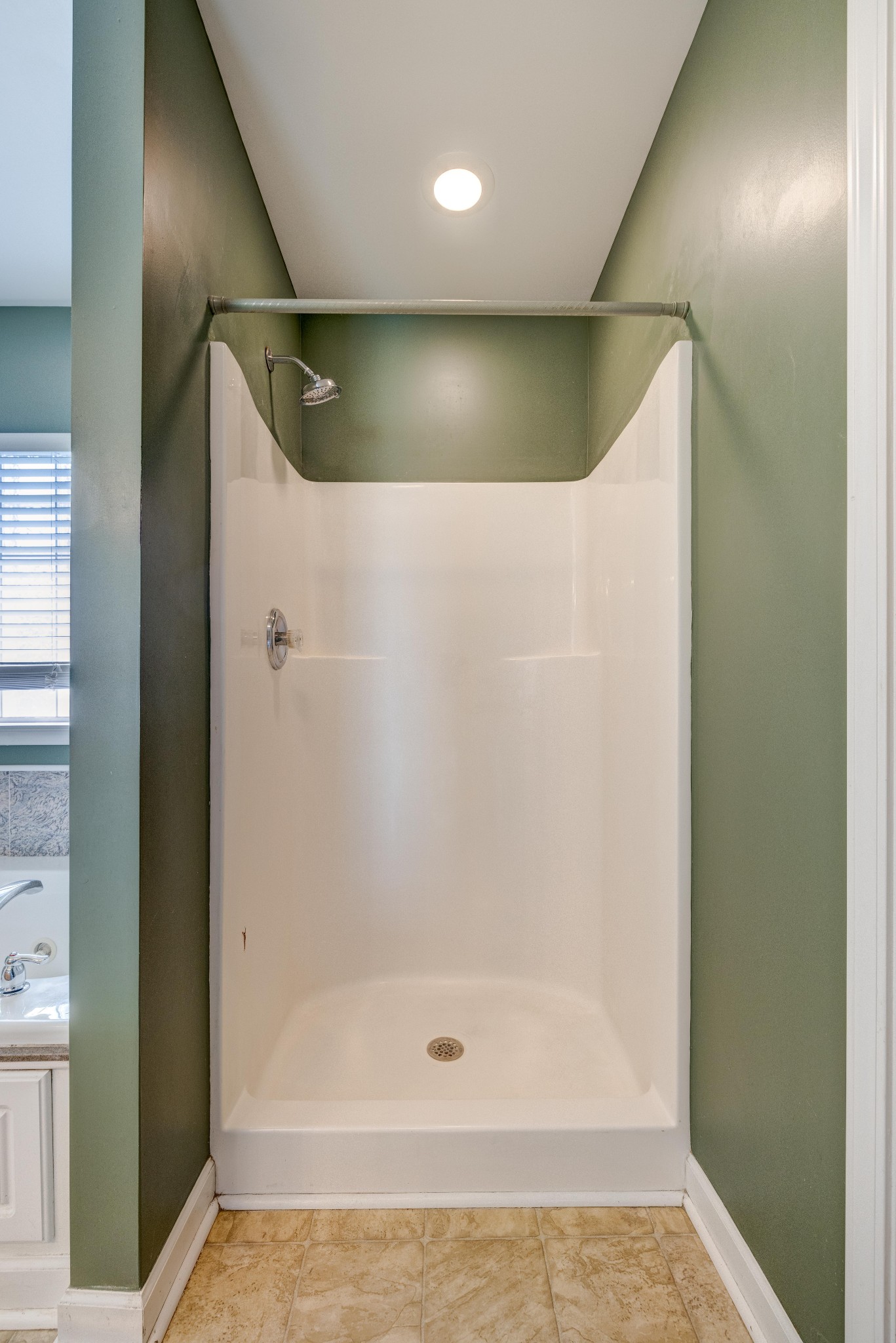 582 Cedar Grove Road Lebanon, TN 37087 - Photo 22 of 47 a bathroom with a glass shower door and a window