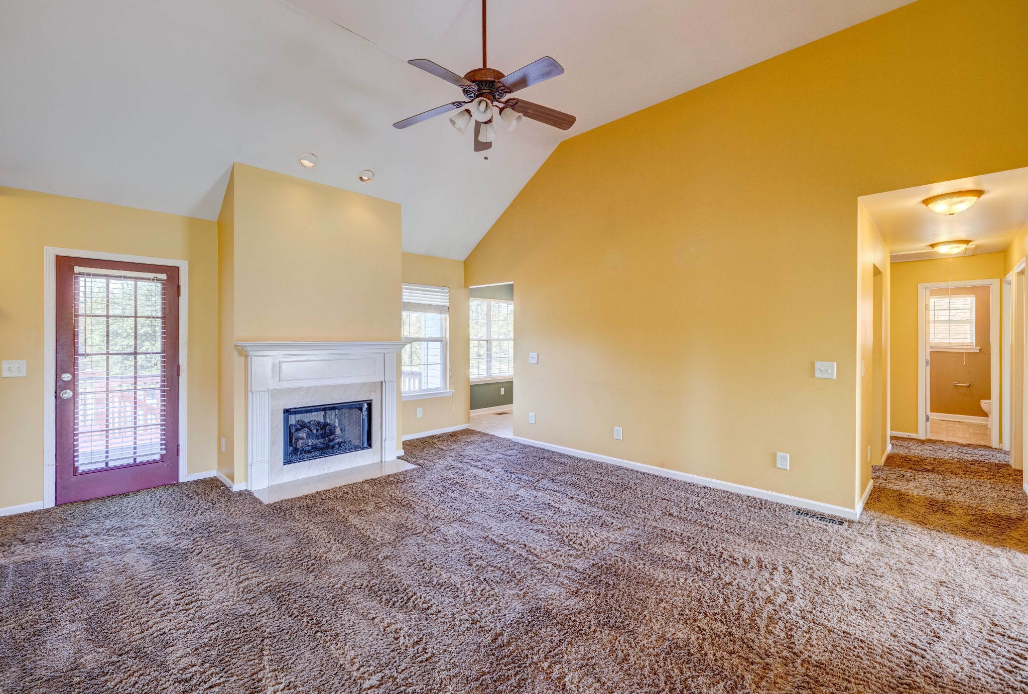 582 Cedar Grove Road Lebanon, TN 37087 - Photo 7 of 47 a view of an empty room with a fireplace and a window