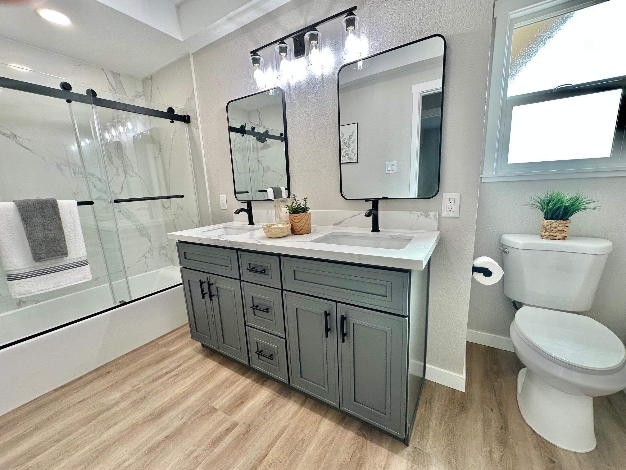 225 Kent Place San Ramon, CA 94583 - Photo 16 of 32 a bathroom with a double vanity sink mirror and toilet