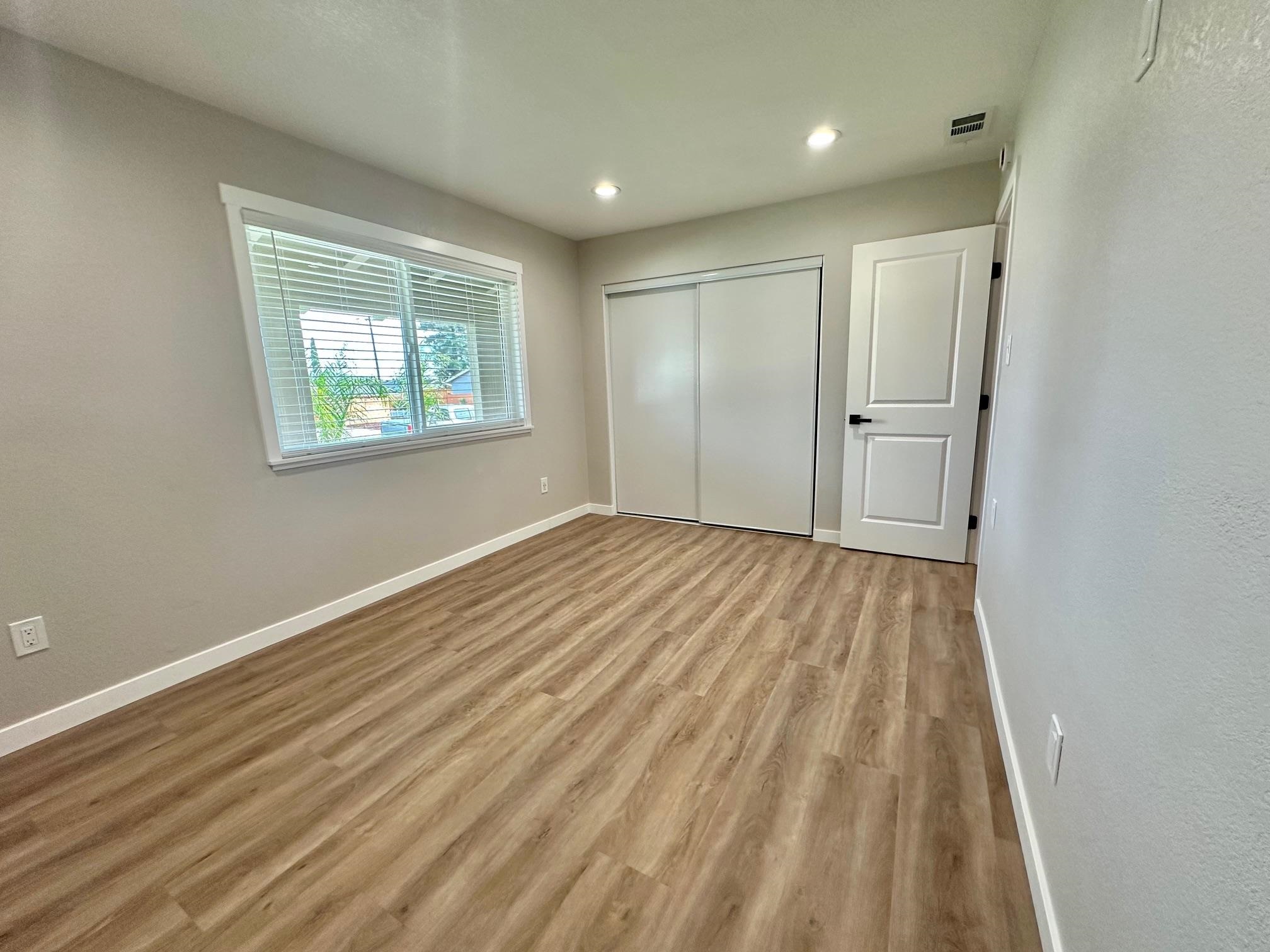 225 Kent Place San Ramon, CA 94583 - Photo 19 of 32 a view of empty room with wooden floor and fan
