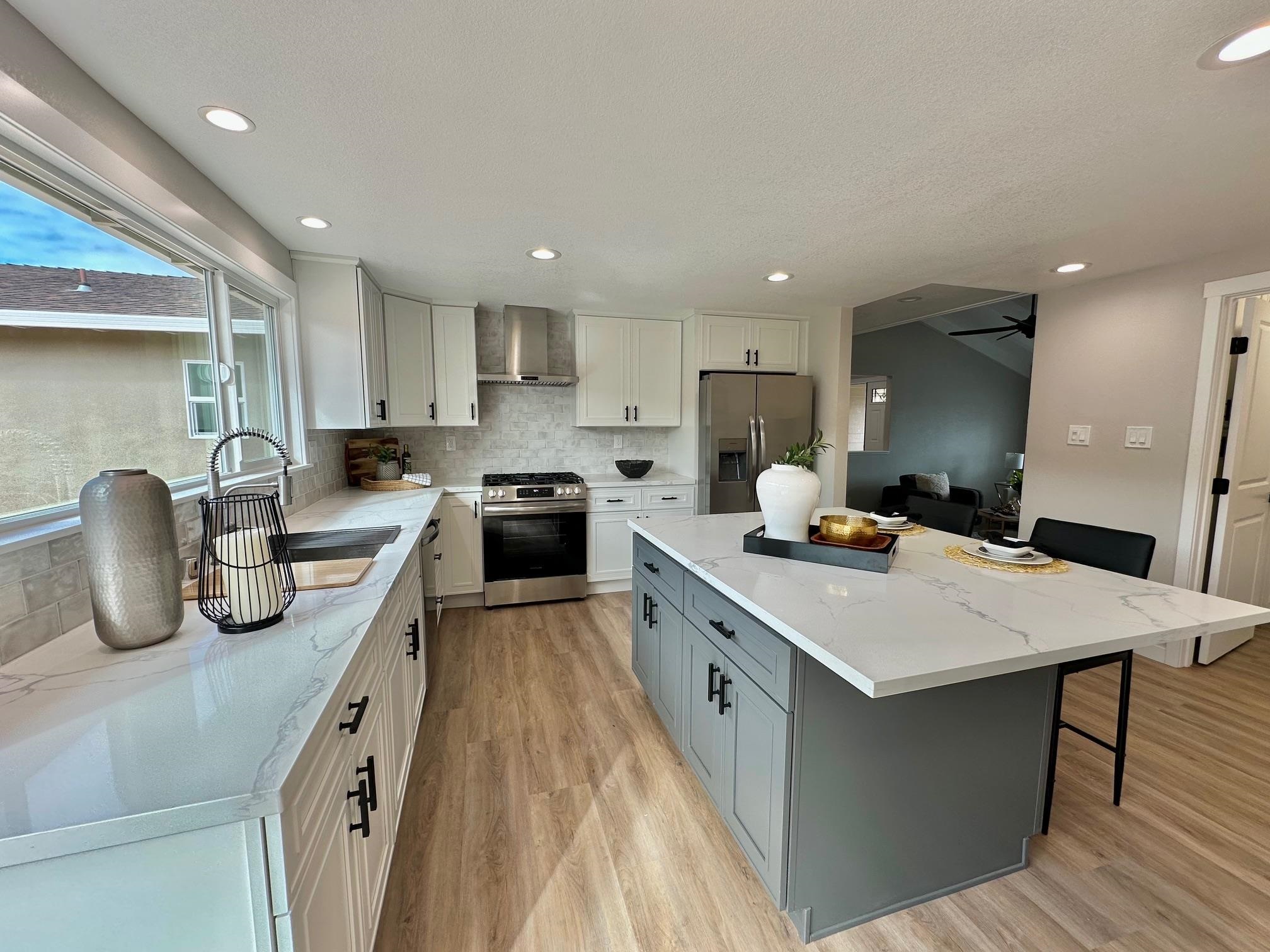 225 Kent Place San Ramon, CA 94583 - Photo 9 of 32 a kitchen with granite countertop a sink a counter top space stainless steel appliances and cabinets