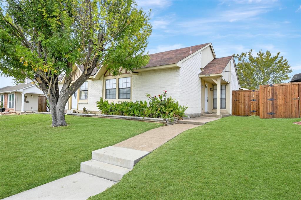 6018 McAfee Drive The Colony, TX 75056 - Photo 2 of 28 a front view of a house with a yard and garage