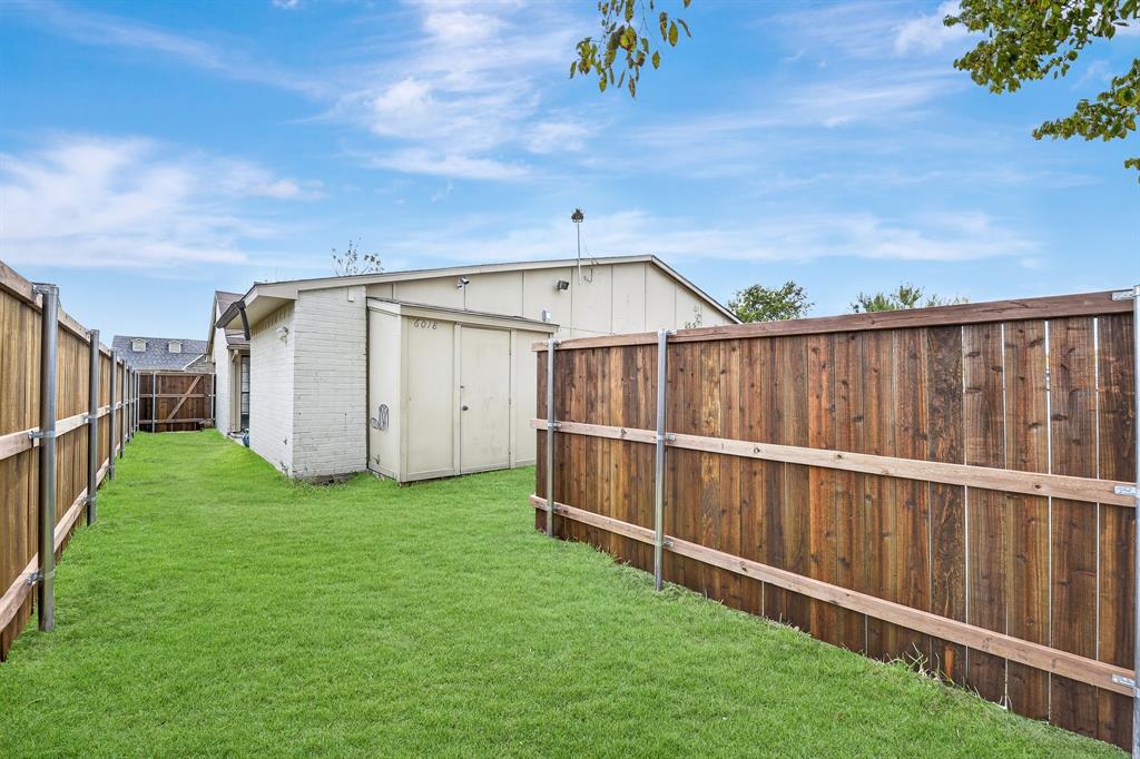 6018 McAfee Drive The Colony, TX 75056 - Photo 26 of 28 a view of a backyard with wooden fence