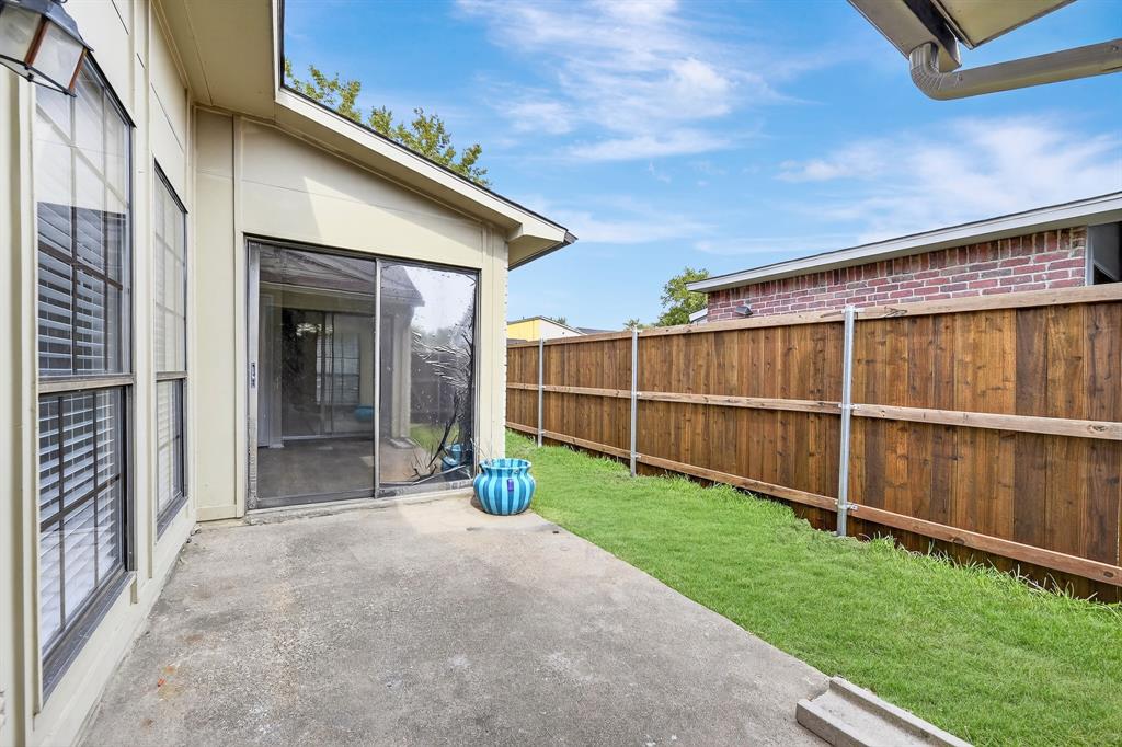 6018 McAfee Drive The Colony, TX 75056 - Photo 27 of 28 a view of a backyard with a garden