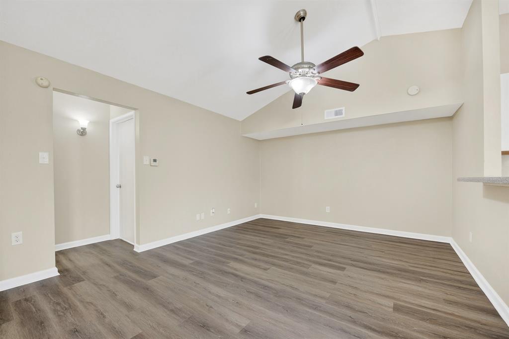 6018 McAfee Drive The Colony, TX 75056 - Photo 6 of 28 a view of an empty room with wooden floor