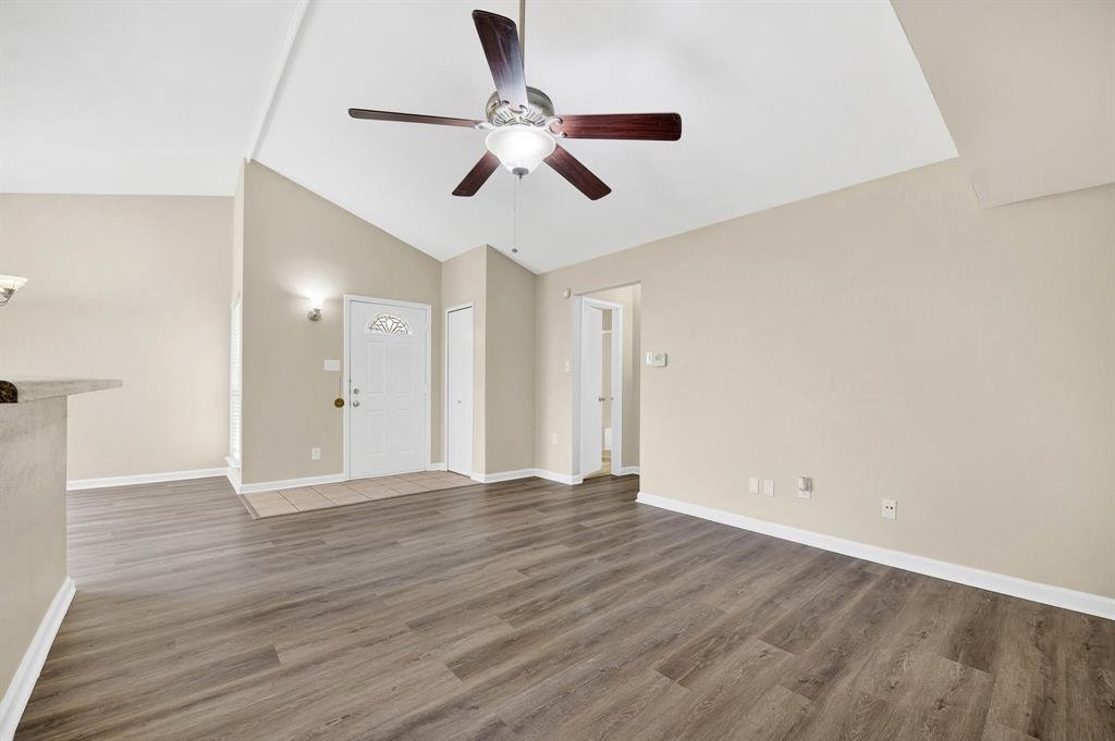 6018 McAfee Drive The Colony, TX 75056 - Photo 8 of 28 a view of an empty room with wooden floor