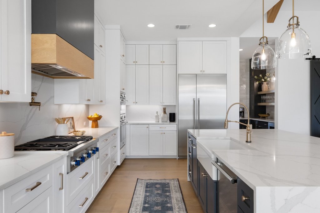 6316 Caudill Lane Austin, TX 78738 - Photo 11 of 40 a kitchen with a sink stove and cabinets