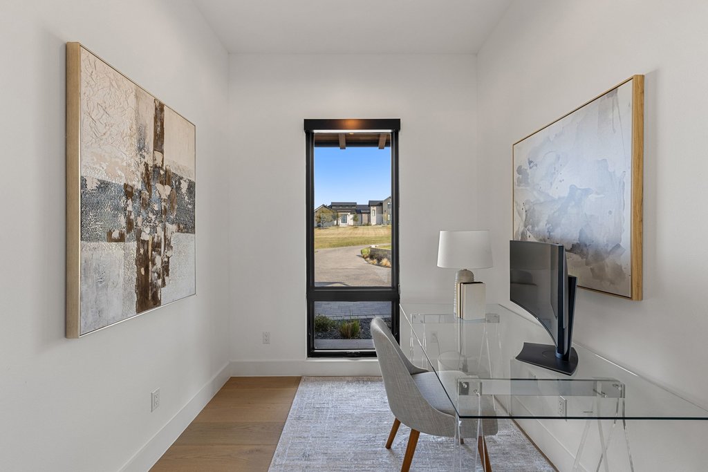 6316 Caudill Lane Austin, TX 78738 - Photo 14 of 40 a view of a hallway with paintings on the wall