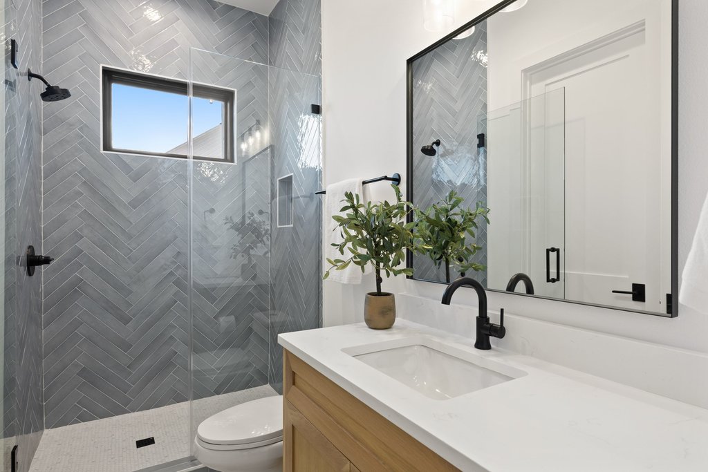 6316 Caudill Lane Austin, TX 78738 - Photo 24 of 40 a bathroom with a sink a toilet and shower