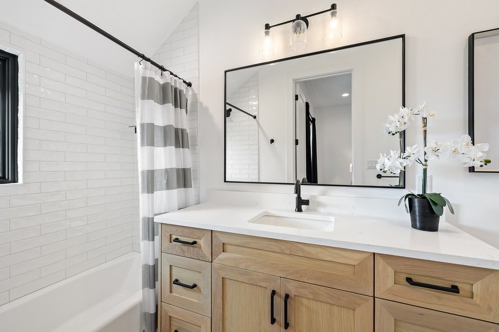 6316 Caudill Lane Austin, TX 78738 - Photo 26 of 40 a bathroom with a sink and a mirror