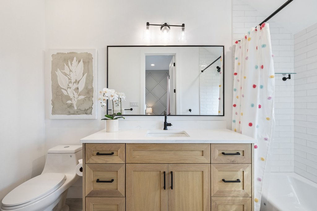 6316 Caudill Lane Austin, TX 78738 - Photo 28 of 40 a bathroom with a sink and a mirror