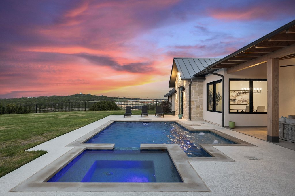 6316 Caudill Lane Austin, TX 78738 - Photo 30 of 40 a view of swimming pool with a lounge chair and a big yard