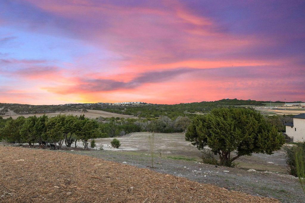 6316 Caudill Lane Austin, TX 78738 - Photo 37 of 40 a view of a lake with a mountain in the background
