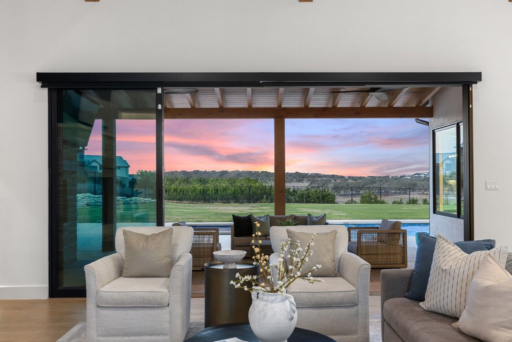 6316 Caudill Lane Austin, TX 78738 - Photo 7 of 40 a living room with patio furniture and a floor to ceiling window