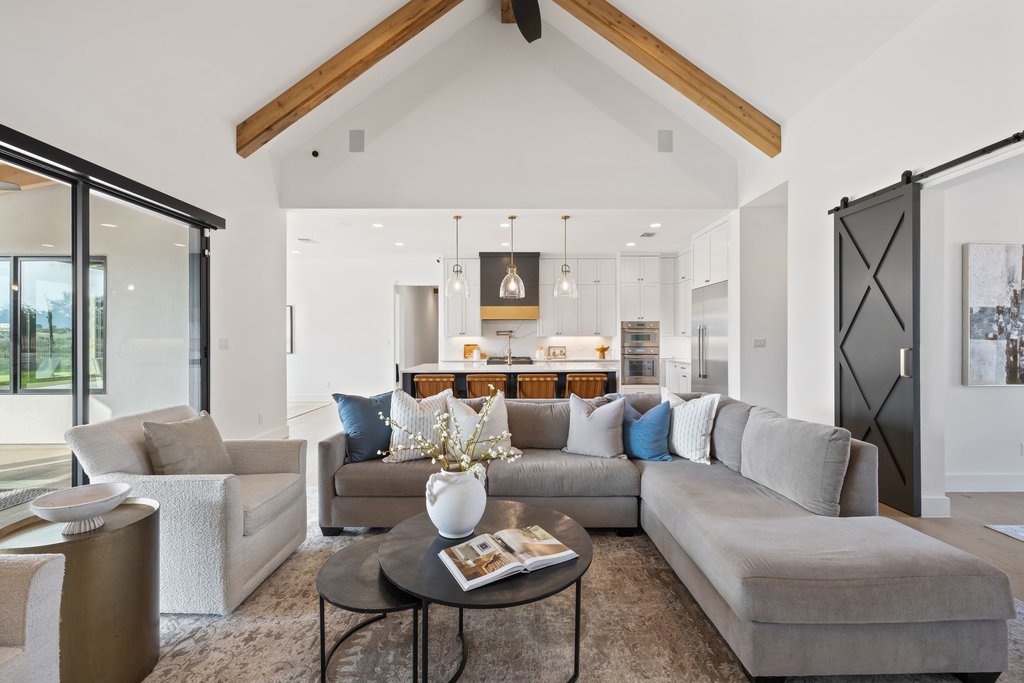 6316 Caudill Lane Austin, TX 78738 - Photo 8 of 40 a living room with furniture and a large window