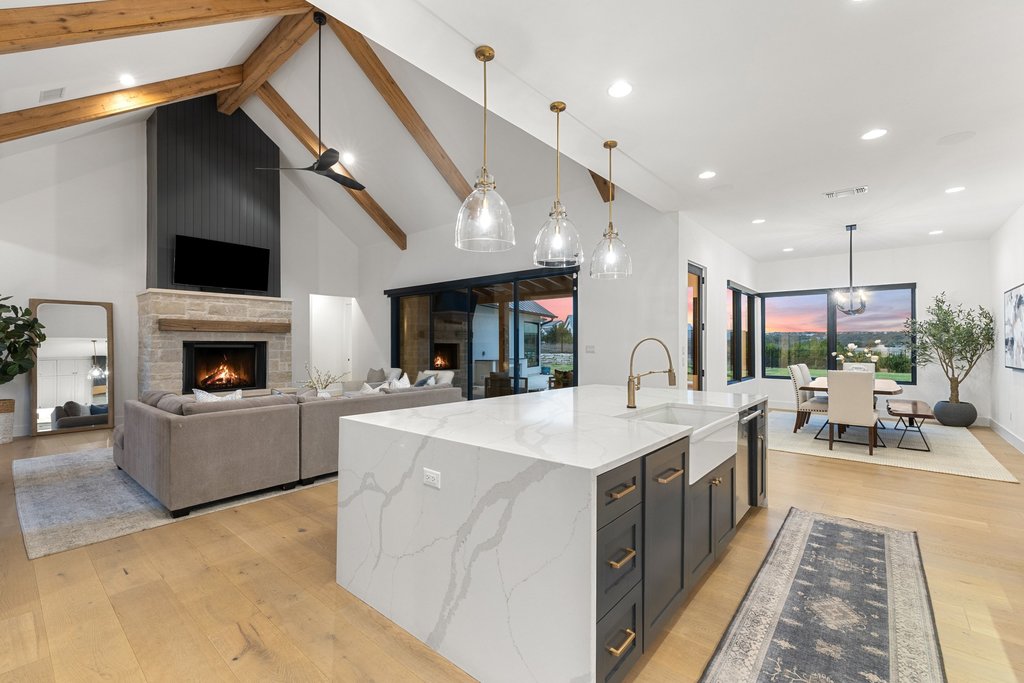 6316 Caudill Lane Austin, TX 78738 - Photo 40 of 40 a large white kitchen with a large window a sink and stainless steel appliances