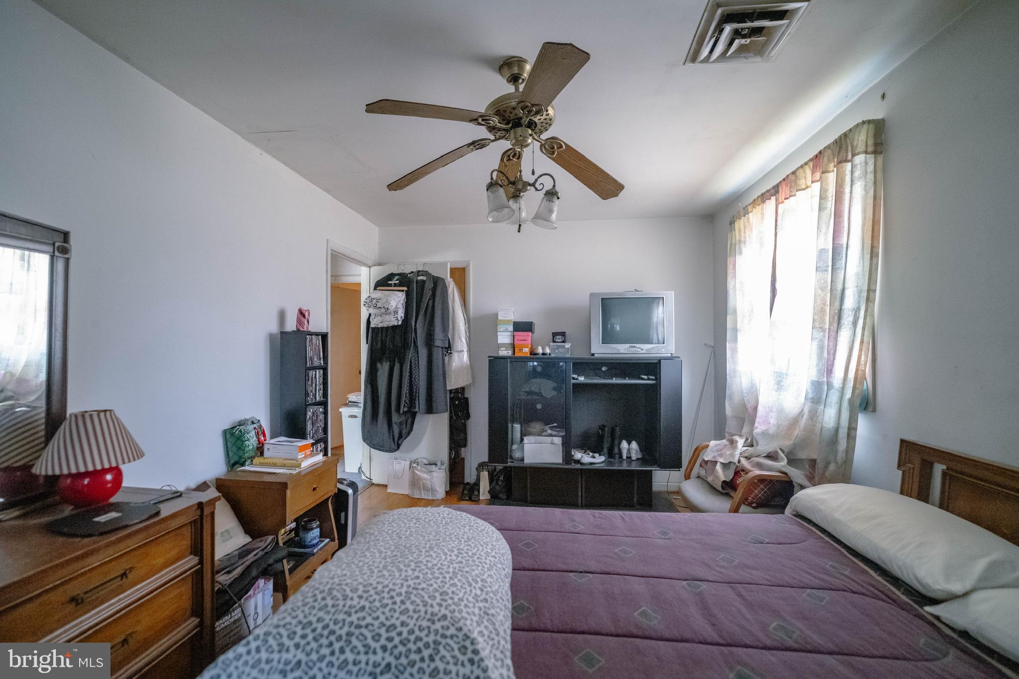 6900 Temple Hill Road Temple Hills, MD 20748 - Photo 35 of 43 a living room with furniture ceiling fan and a window