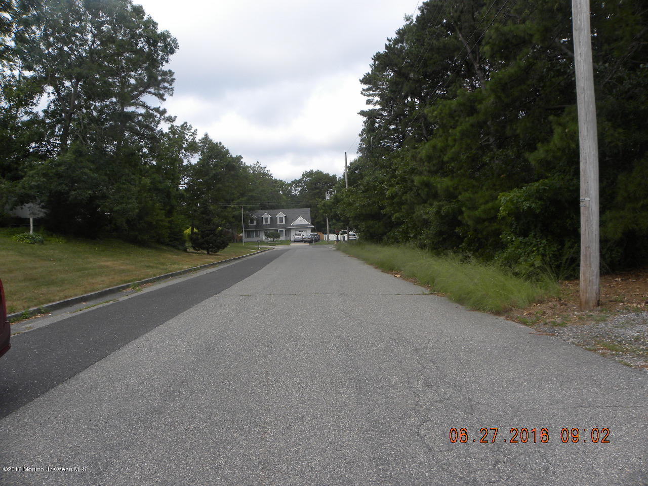 119 Sailing Road Manahawkin, NJ 08050 - Photo 8 of 8 a view of a road with a yard