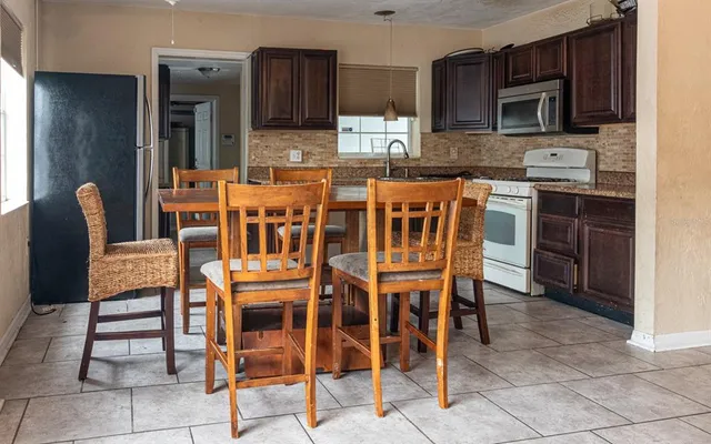 a view of a dining room with furniture