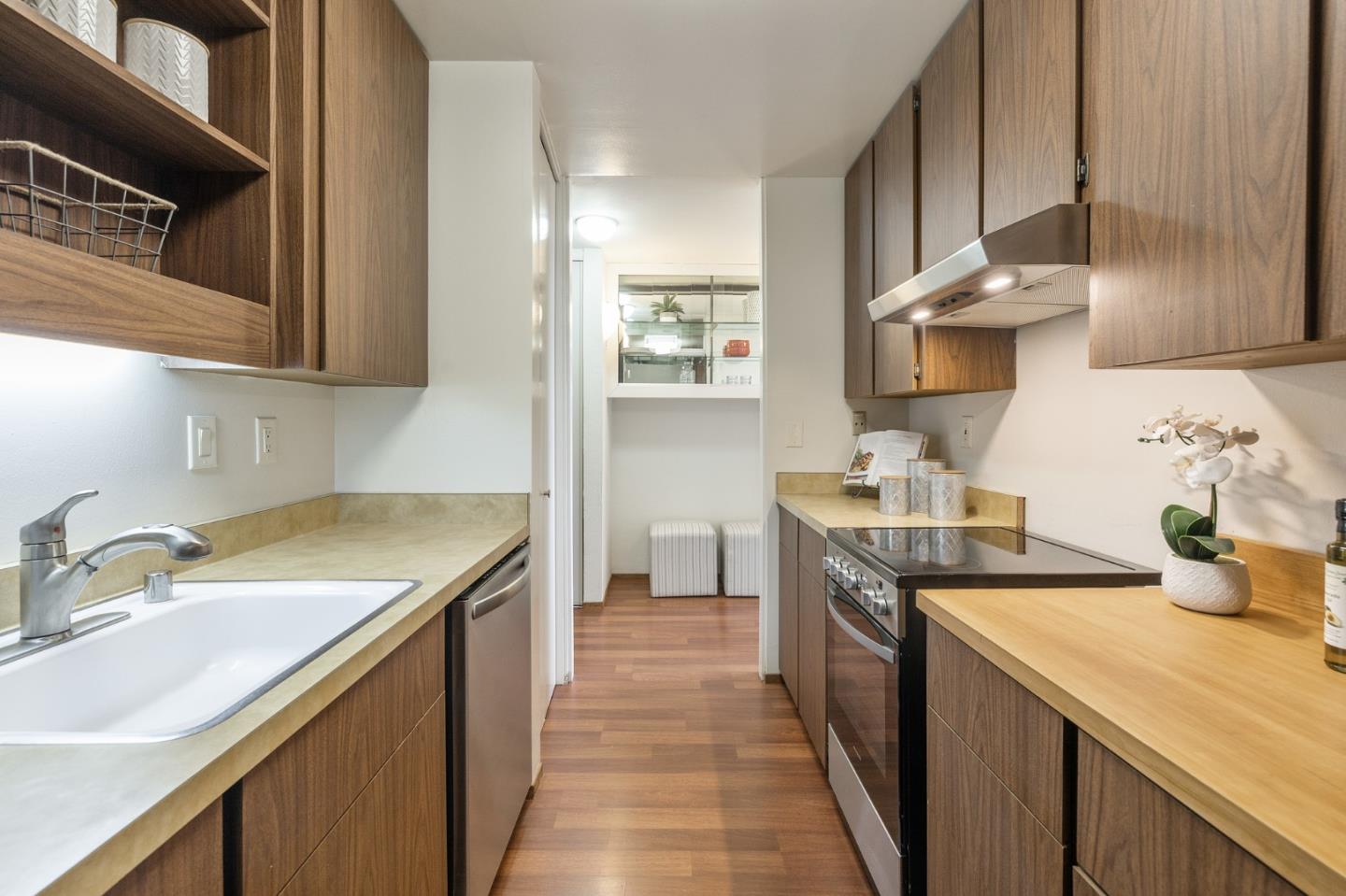 320 Vallejo Drive, Unit 23 Millbrae, CA 94030 - Photo 14 of 50 a kitchen with a sink stove and cabinets