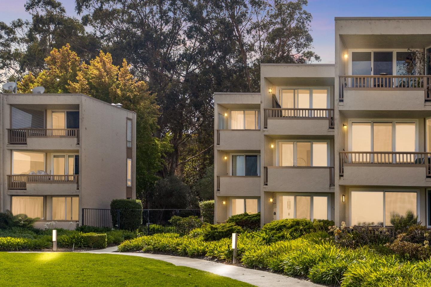 320 Vallejo Drive, Unit 23 Millbrae, CA 94030 - Photo 2 of 50 a front view of a house with a yard and outdoor seating
