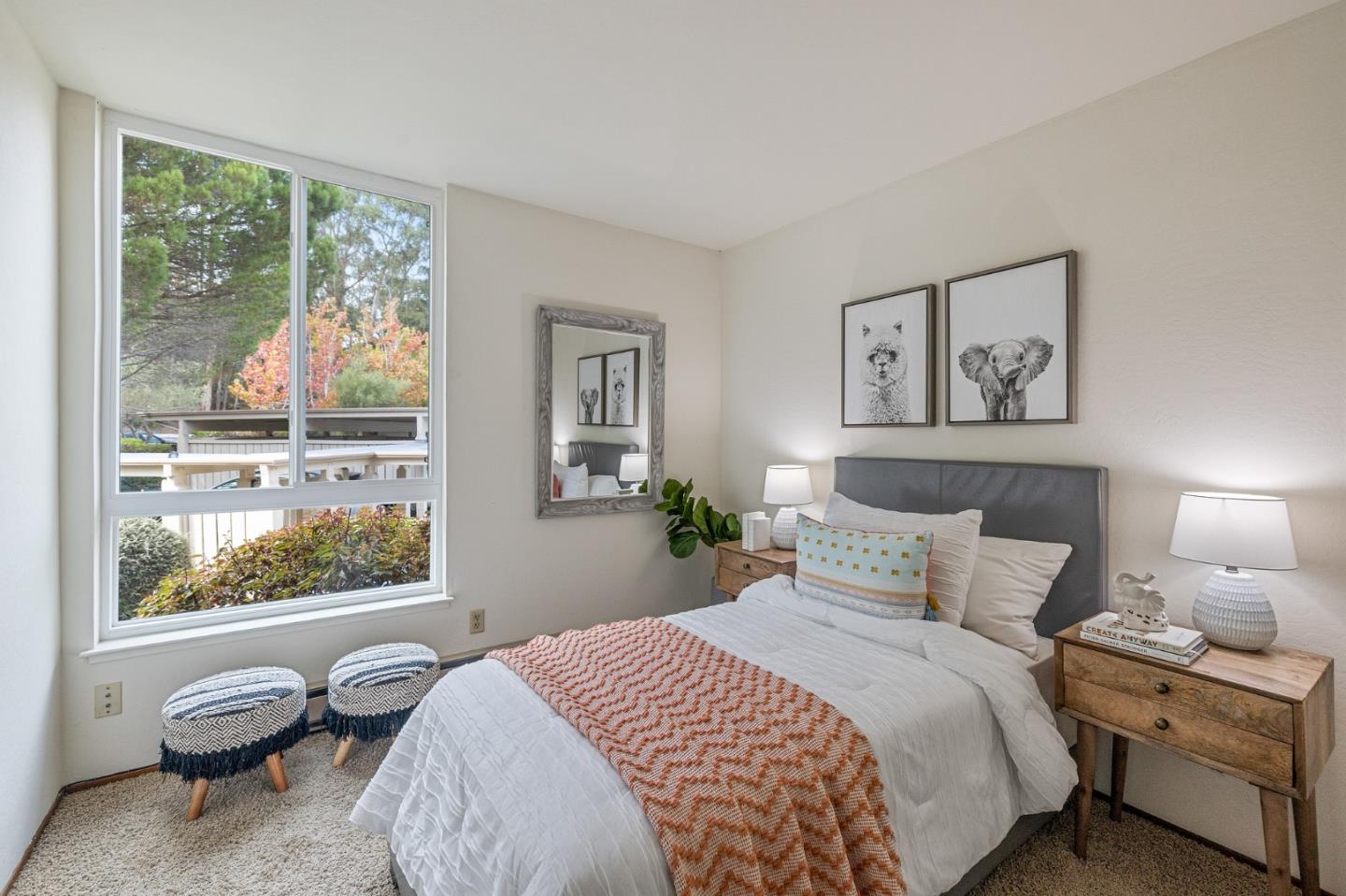 320 Vallejo Drive, Unit 23 Millbrae, CA 94030 - Photo 23 of 50 a bedroom with a bed and a painting on the wall