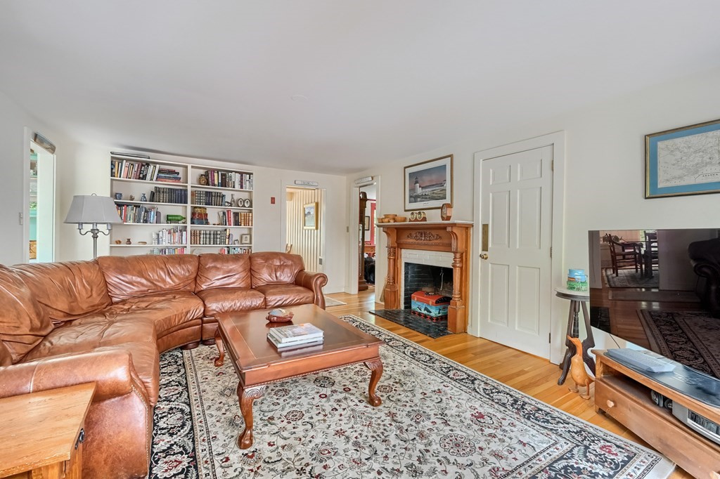 214 Park Avenue Barnstable, MA 02632 - Photo 11 of 42 a living room with furniture and a fireplace
