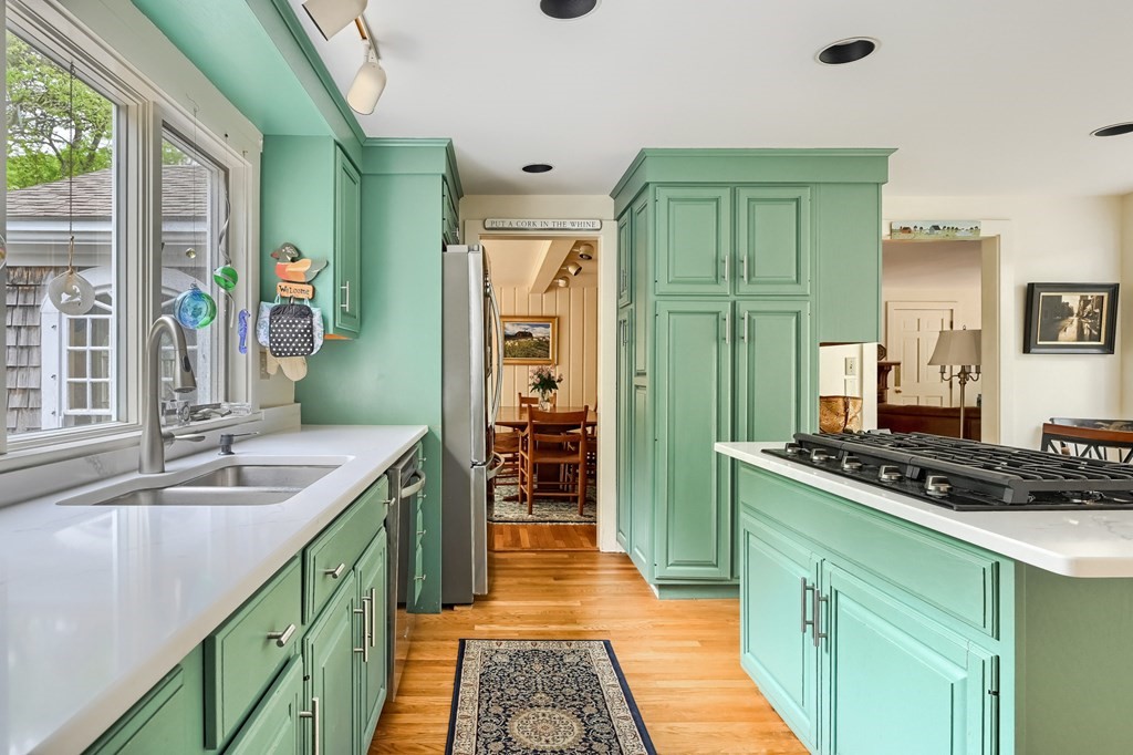 214 Park Avenue Barnstable, MA 02632 - Photo 16 of 42 a kitchen with stainless steel appliances granite countertop a sink and cabinets