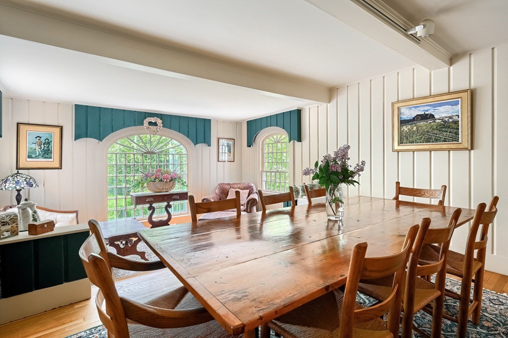 214 Park Avenue Barnstable, MA 02632 - Photo 19 of 42 a view of a dining room with furniture window and wooden floor