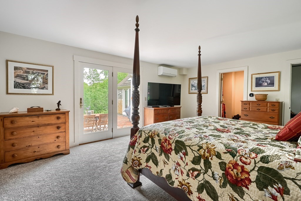 214 Park Avenue Barnstable, MA 02632 - Photo 27 of 42 a bed room with a bed and a television