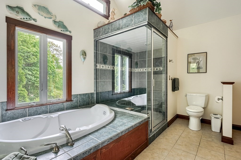 214 Park Avenue Barnstable, MA 02632 - Photo 29 of 42 a spacious bathroom with a granite countertop tub and a sink