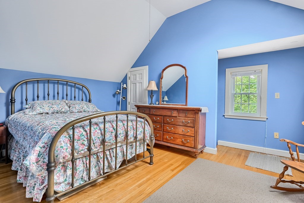 214 Park Avenue Barnstable, MA 02632 - Photo 36 of 42 a bedroom with a bed and a dresser next to a window