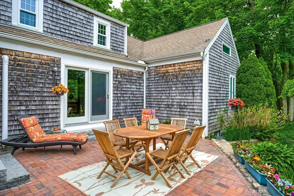 214 Park Avenue Barnstable, MA 02632 - Photo 41 of 42 a backyard of a house with table and chairs