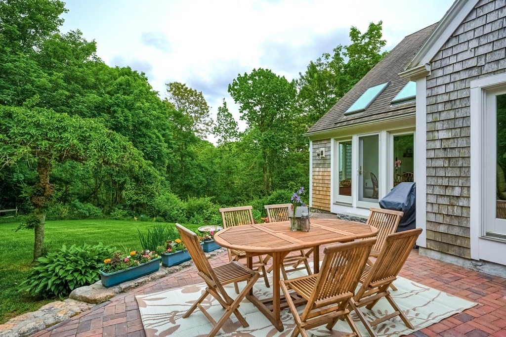 214 Park Avenue Barnstable, MA 02632 - Photo 42 of 42 a view of a patio with a table and chairs