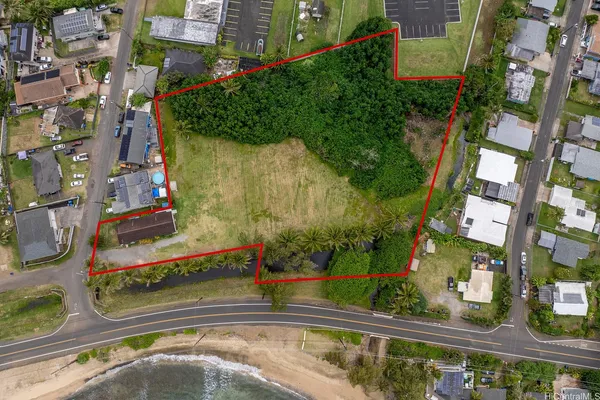 an aerial view of a house with a swimming pool