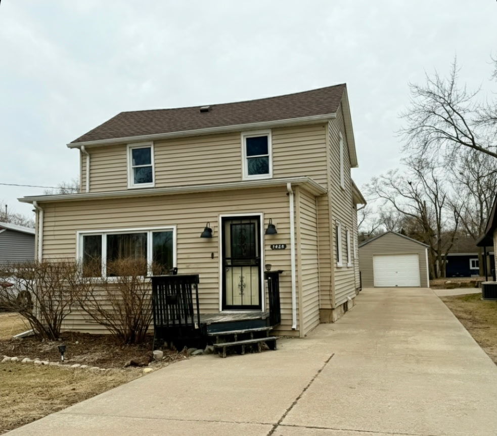 1429 Phelps Street Ottawa, IL 61350 - Photo 1 of 27 a front view of a house with a garage